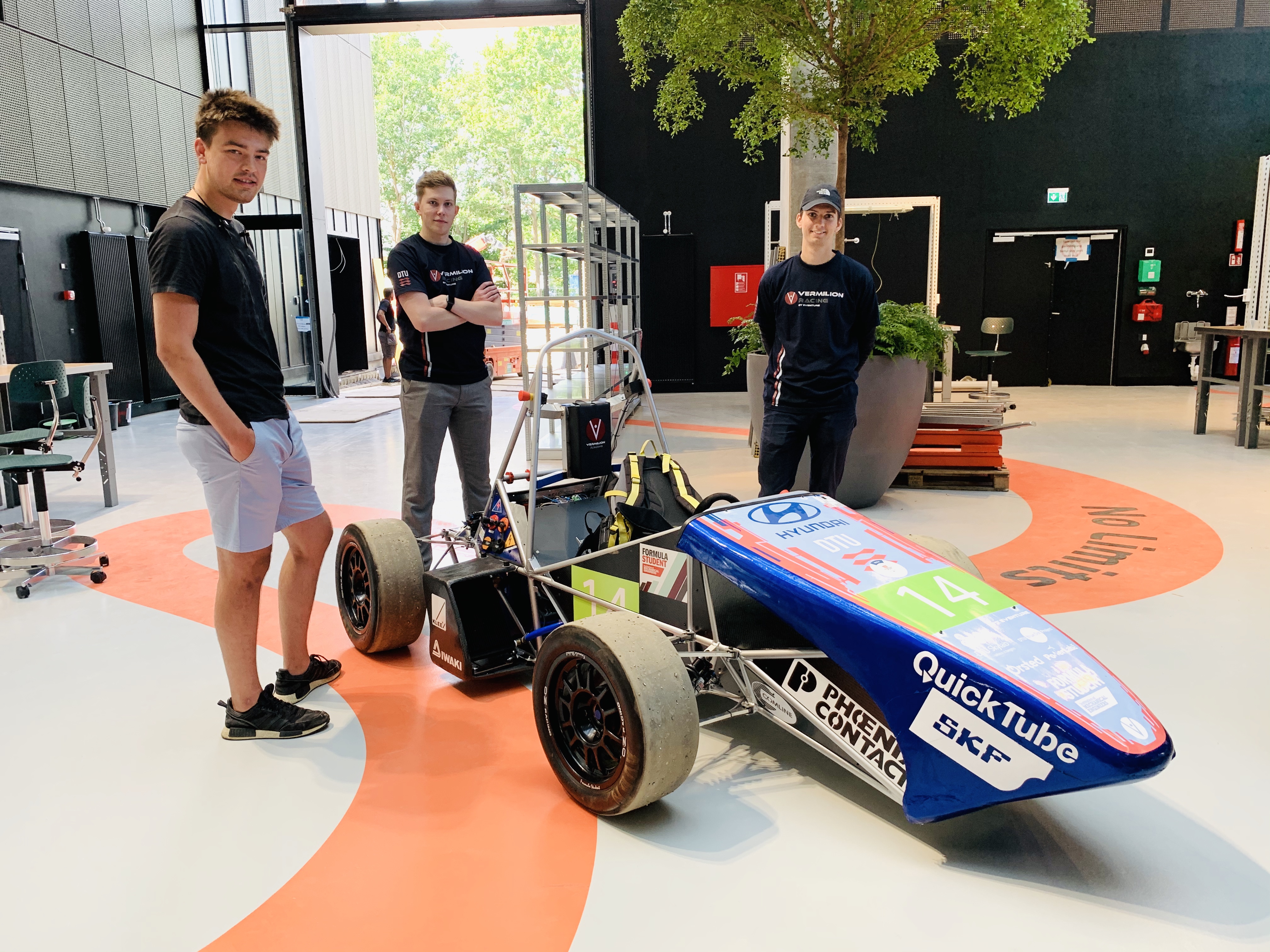 Team members and race car from Vermillion Racing in the Developer Hall