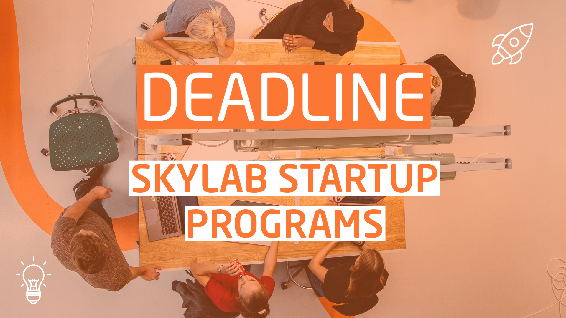 An bird's eye photo of a group of people sitting around a desk, with a text overlaying the image saying "Deadline - Skylab Startup Programs"
