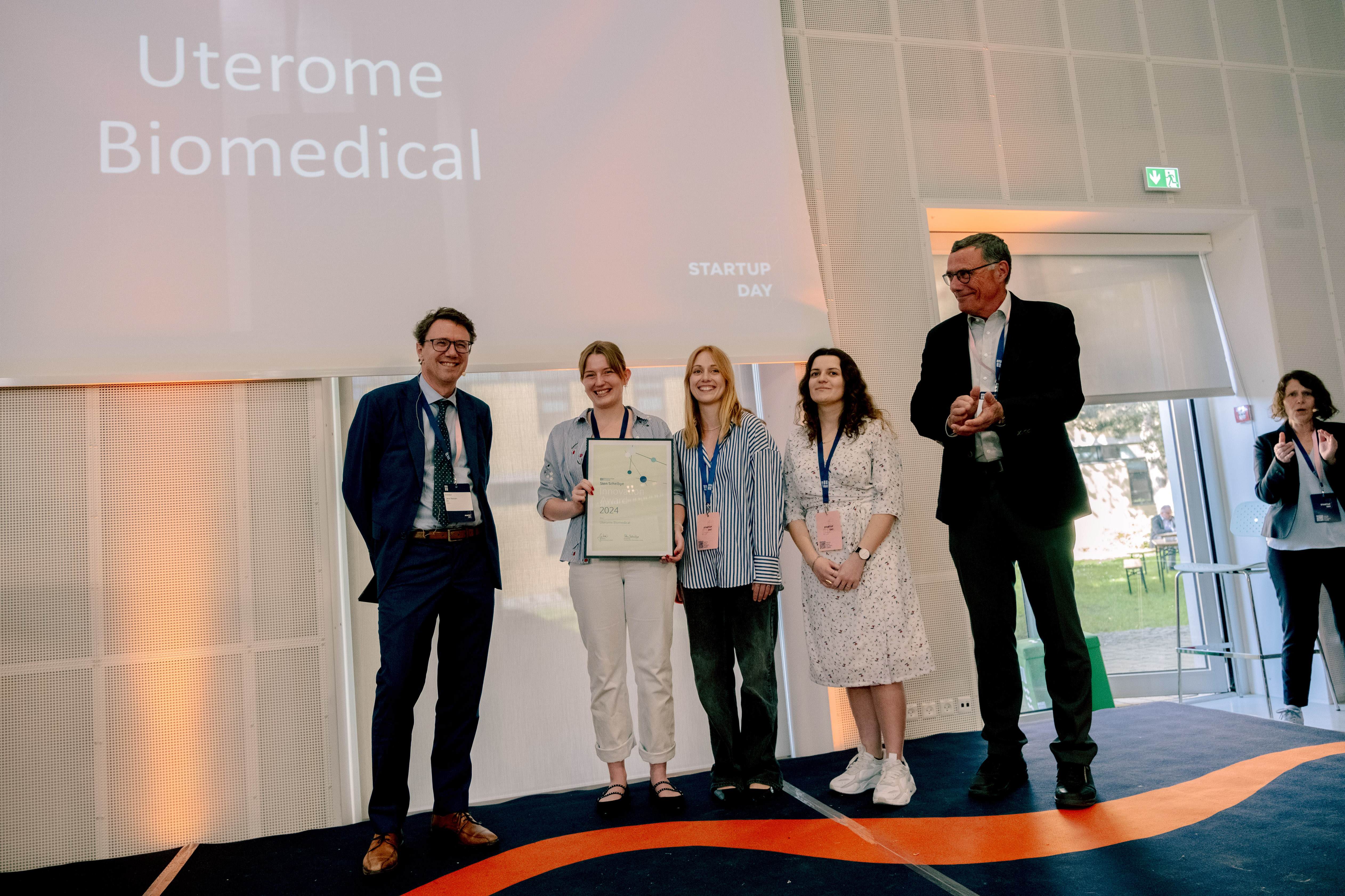 Photo of the three female founders of Uterome Biomedical accepting the Sten Scheibye Award at DTU Startup Day 2024